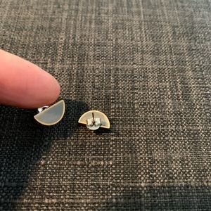 Gold-rimmed grey half moon earrings